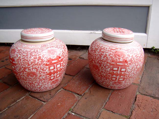 An attractive pair of salmon colored Chinese "Double Happiness" ginger jars, 20th century